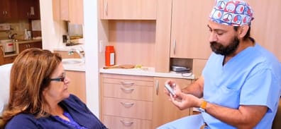 Dr. Arora discussing treatment options with a patient
